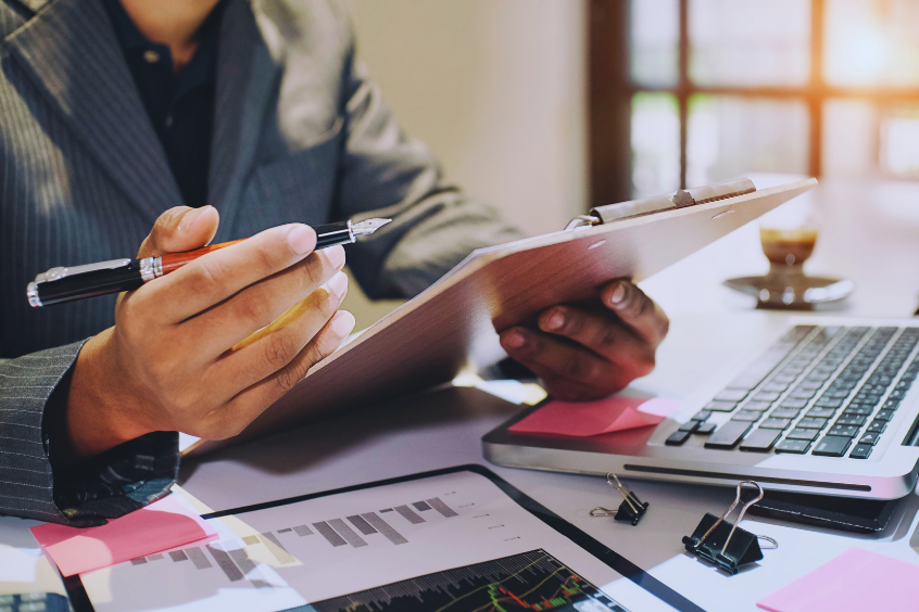 Professional reviewing business data at a desk