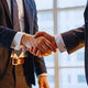 Two businessmen shaking hands as sign of approval
