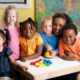 Young children in preschool or kindergarten with their teacher
