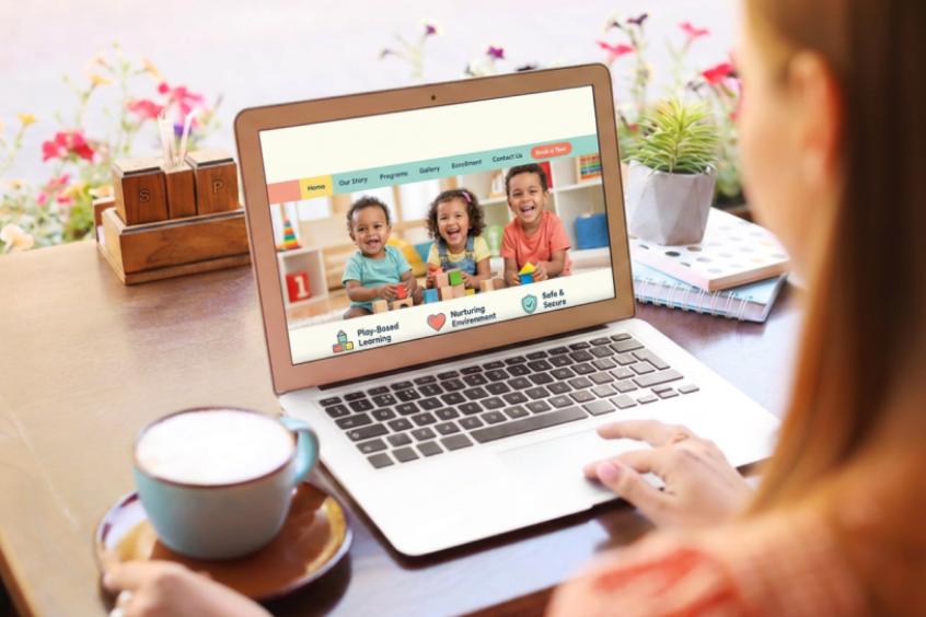Woman looking at a childcare website on her laptop